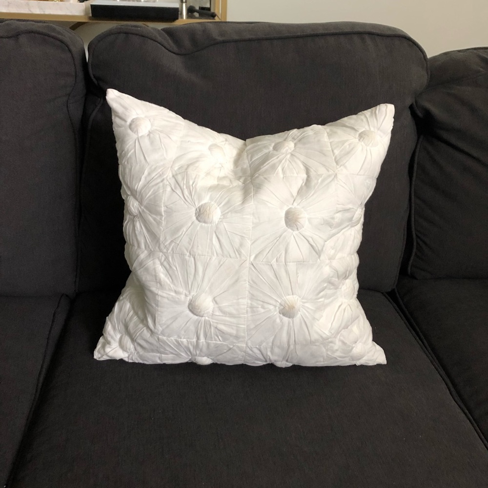 White DKNY throw pillow